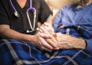 a Hospice Nurse visiting an Elderly male patient