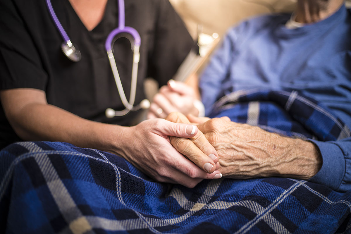 a Hospice Nurse visiting an Elderly male patient