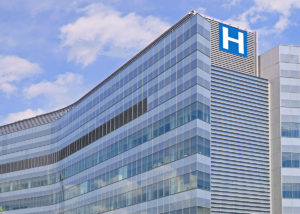 Building with large H sign for hospital